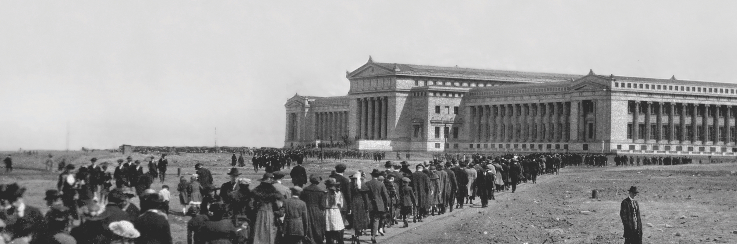 Image featuring a line of visitors waiting to enter the museum on its opening day